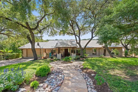 Westlake home under oaks